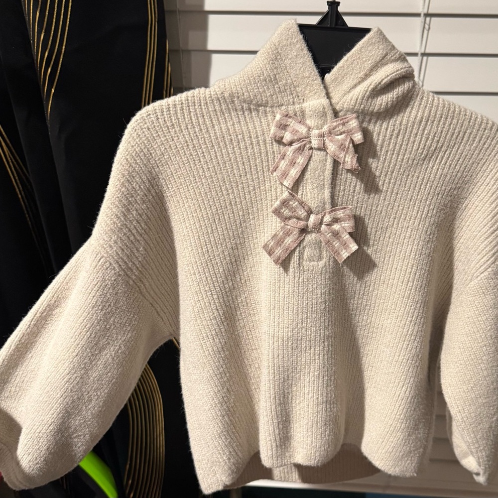 Cozy Cream Sweater with Bow Accents